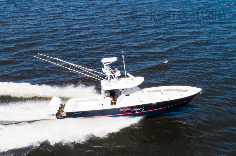 Slide: The Image of 2016 Regulator 41 boat cruising on open water, side view. - 24