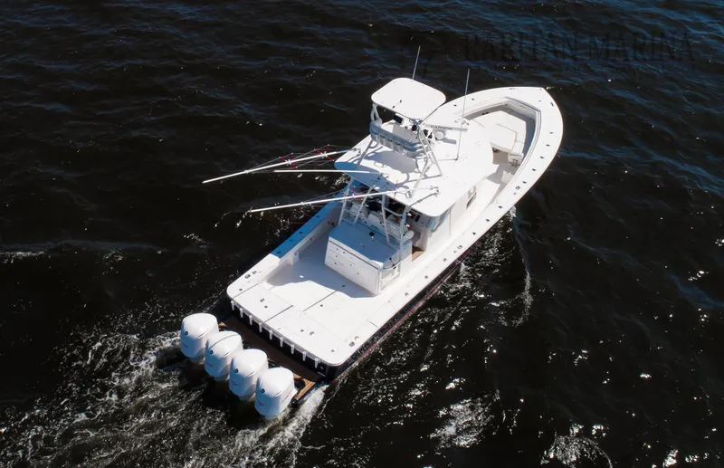 Slide: The Image of Aerial view of 2016 Regulator 41 boat cruising on dark water. - 25