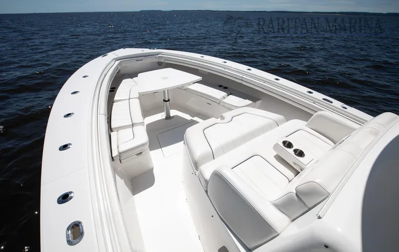 Slide: The Image of 2016 Regulator 41 boat with spacious white seating on open water. - 40