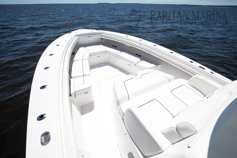 Slide: The Image of 2016 Regulator 41 boat with spacious white seating on open water. - 46