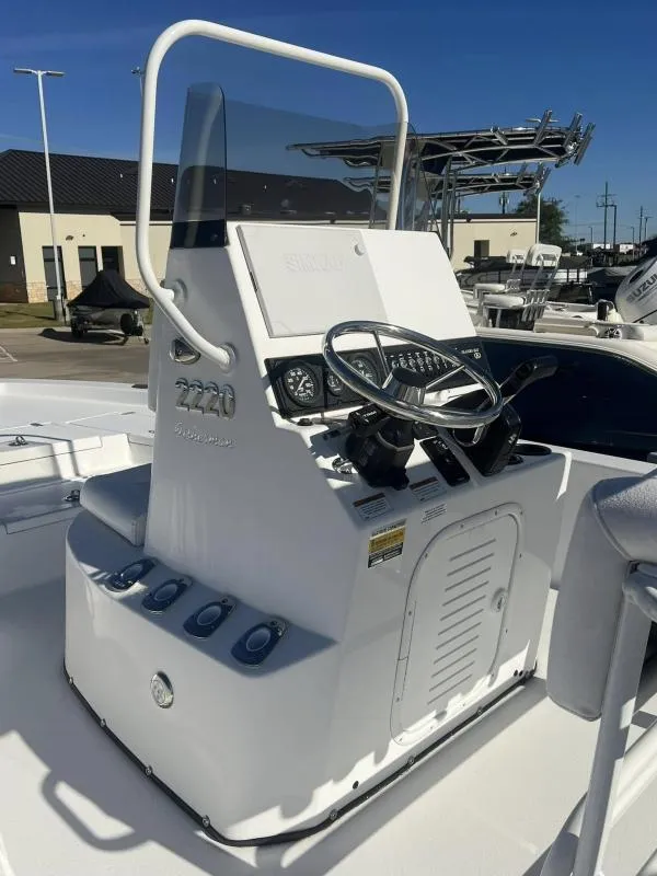 Slide: The Image of 2023 Blazer 2220 Fisherman boat console with steering wheel and controls. - 10