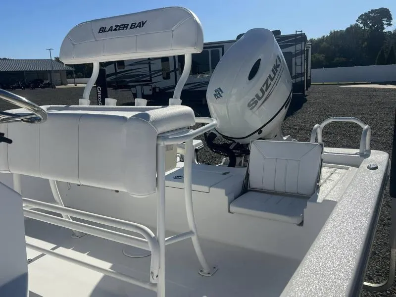 Slide: The Image of 2023 Blazer 2220 Fisherman boat with Suzuki outboard motor, white seating, and spacious deck. - 11