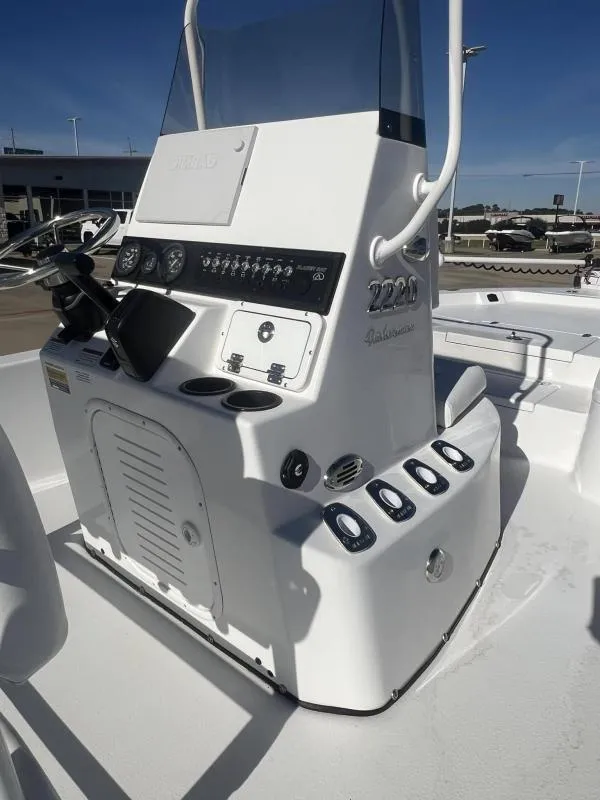 Slide: The Image of 2023 Blazer 2220 Fisherman boat console with steering wheel and controls. - 12