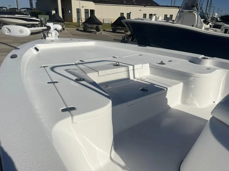 Slide: The Image of 2023 Blazer 2220 Fisherman boat deck in a marina setting. - 7