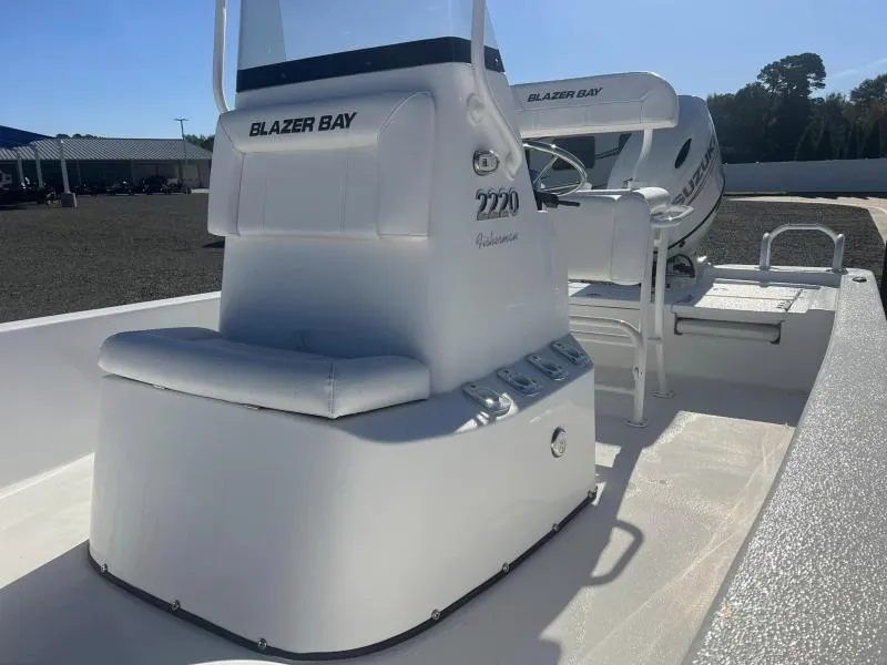 Slide: The Image of 2023 Blazer 2220 Fisherman boat interior with seating and controls. - 8