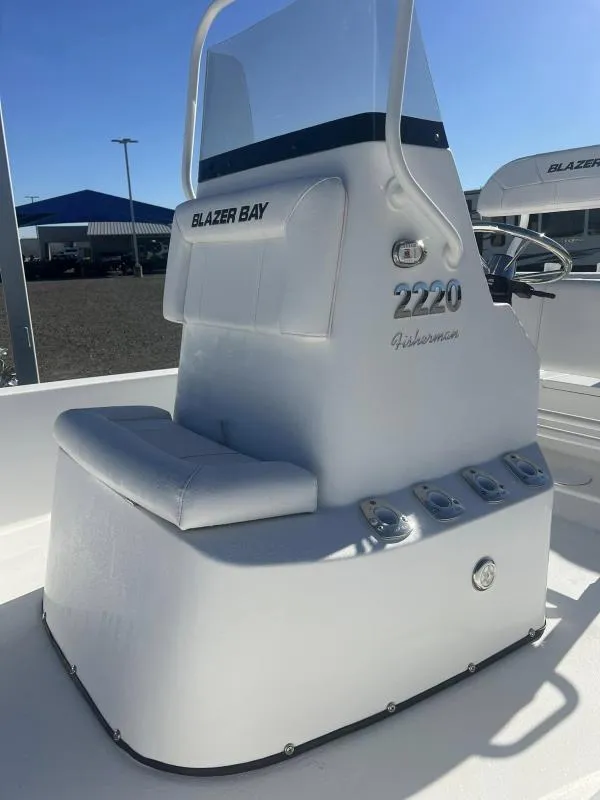 Slide: The Image of 2023 Blazer 2220 Fisherman boat console with seating and controls. - 9