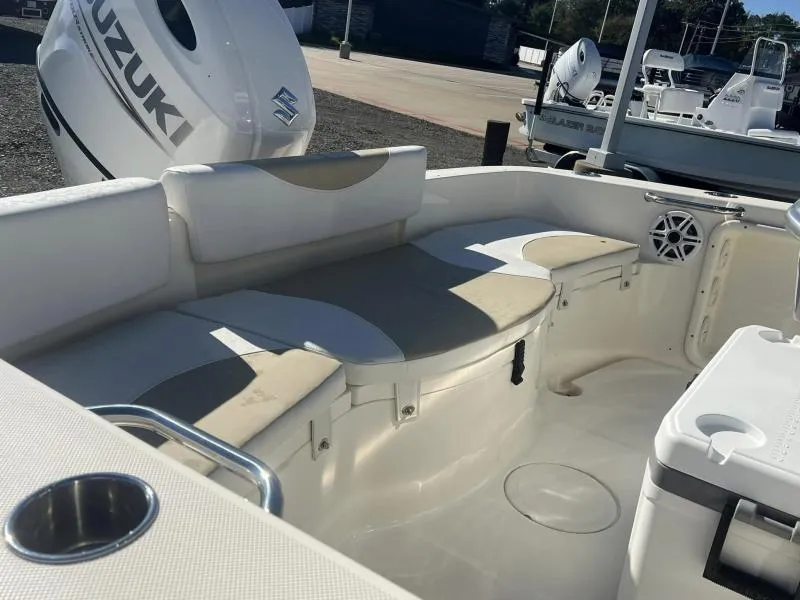 Slide: The Image of 2024 Bulls Bay 200CC boat interior with seating and Suzuki outboard motor. - 12