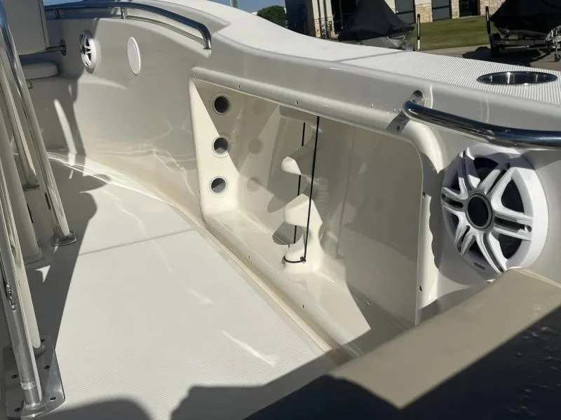 Slide: The Image of 2024 Bulls Bay 200CC boat interior with speaker and rod holders. - 14
