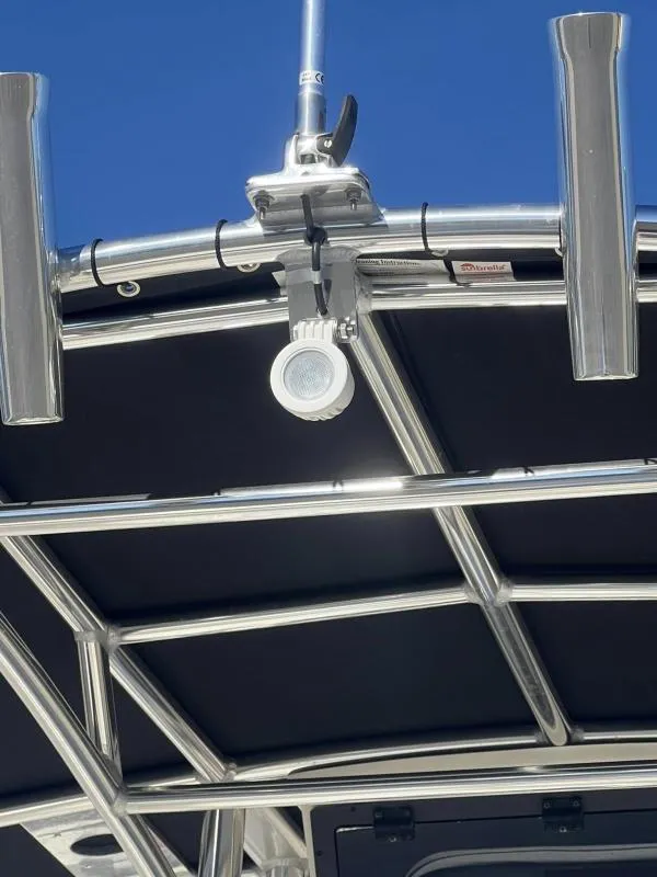 Slide: The Image of 2024 Bulls Bay 200CC boat T-top with rod holders and light fixture. - 15