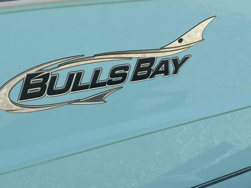 Slide: The Image of Bulls Bay 200CC 2024 logo on a light blue boat surface. - 16