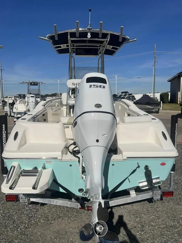 Slide: The Image of 2024 Bulls Bay 200CC boat with 150 HP outboard motor, parked on a trailer. - 4