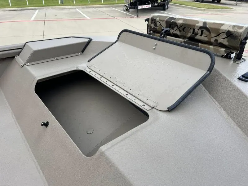 Slide: The Image of 2024 Excel Boats 1860 STALKER storage compartment with open lid, showcasing interior space. - 10