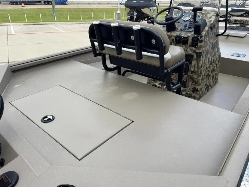 Slide: The Image of 2024 Excel Boats 1860 STALKER interior with camo console and seating. - 13