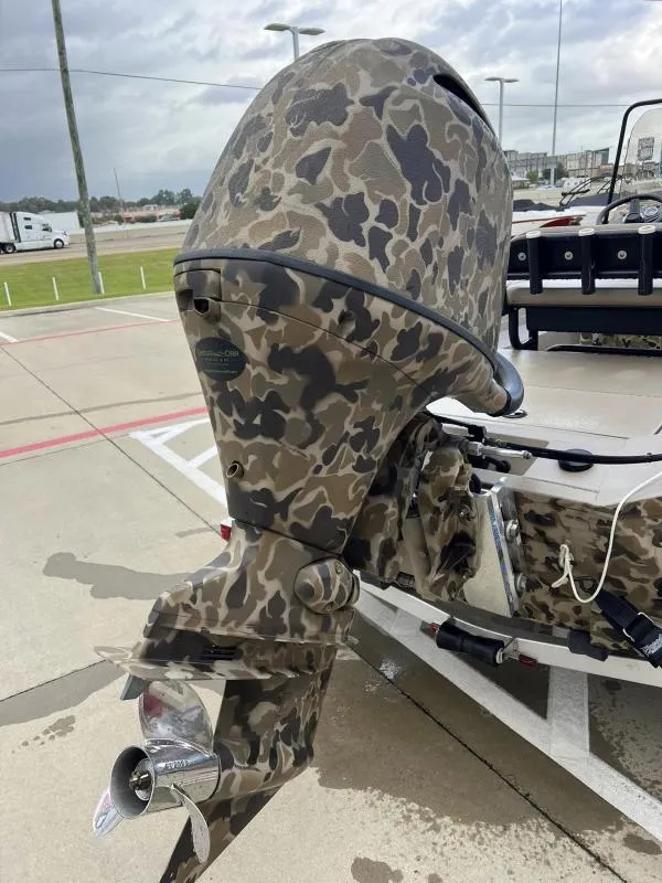 Slide: The Image of Camouflage-patterned outboard motor on 2024 Excel Boats 1860 STALKER. - 14