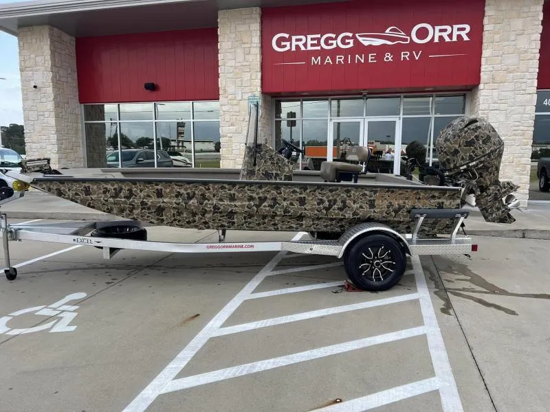 Slide: The Image of 2024 Excel Boats 1860 STALKER camo boat on trailer at Gregg Orr Marine. - 2