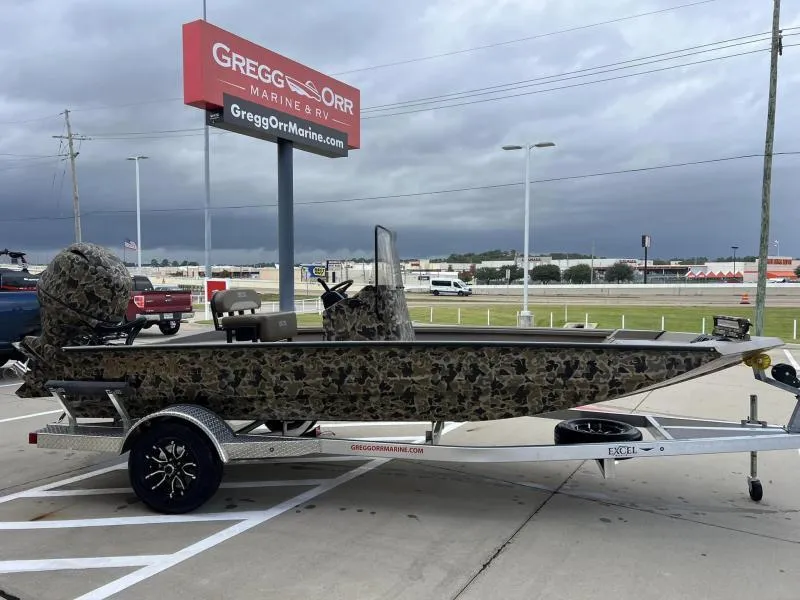 Slide: The Image of 2024 Excel Boats 1860 STALKER camo boat on trailer at dealership. - 5