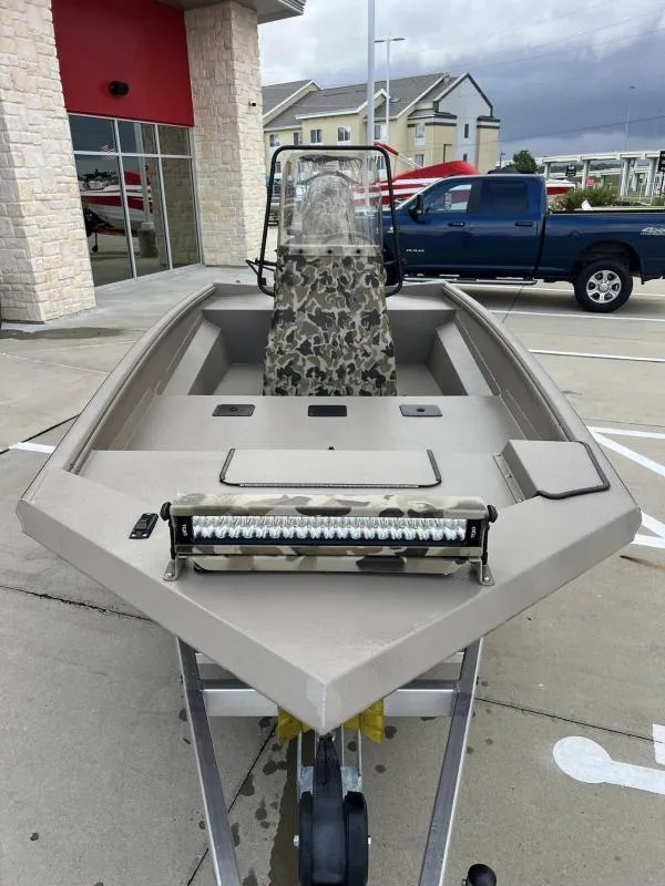 Slide: The Image of 2024 Excel Boats 1860 STALKER in parking lot, featuring camouflage design and LED light bar. - 7