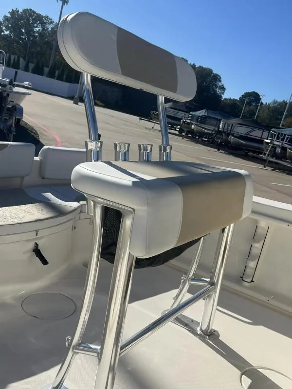 Slide: The Image of 2024 Bulls Bay 200 CC boat seat with rod holders, outdoor setting. - 12