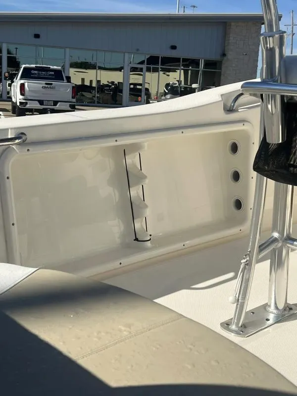 Slide: The Image of 2024 Bulls Bay 200 CC boat interior with seating and rod holders. - 13