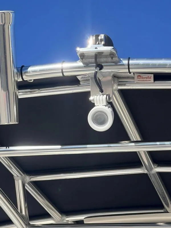 Slide: The Image of 2024 Bulls Bay 200 CC boat with Sunbrella canopy and mounted speaker. - 19