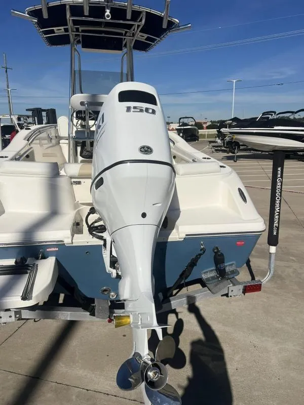 Slide: The Image of 2024 Bulls Bay 200 CC boat with powerful outboard motor, displayed on a trailer. - 4