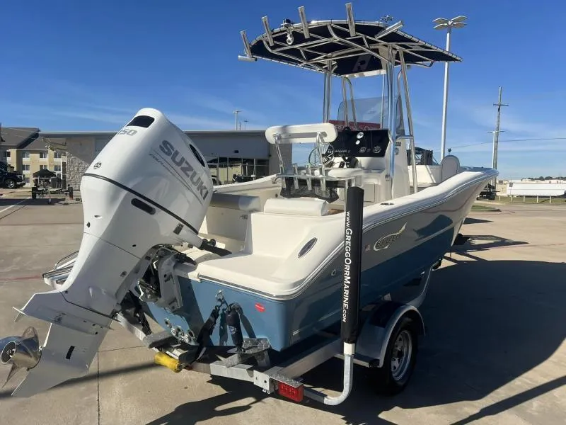 Slide: The Image of 2024 Bulls Bay 200 CC boat with Suzuki engine, parked on a trailer. - 5