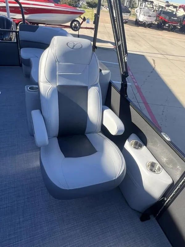 Slide: The Image of 2024 Veranda VR22RC boat seat with cup holders, featuring sleek gray and black design. - 13