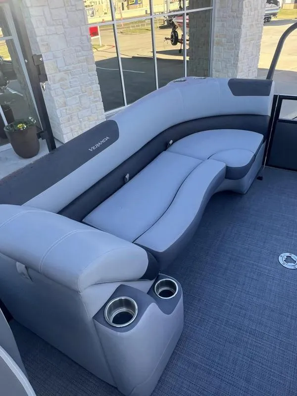 Slide: The Image of 2024 Veranda VR22RC boat interior with plush seating and cup holders. - 15