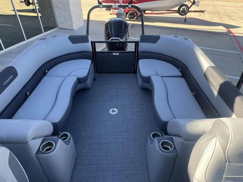 Slide: The Image of 2024 Veranda VR22RC pontoon boat interior with gray seating and cup holders. - 17