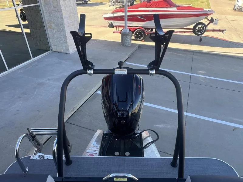 Slide: The Image of 2024 Veranda VR22RC boat with motor and wakeboard rack in a parking lot. - 18