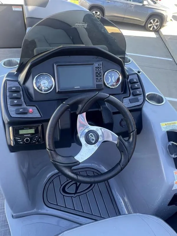 Slide: The Image of 2024 Veranda VR22RC boat dashboard with steering wheel and control panel. - 19