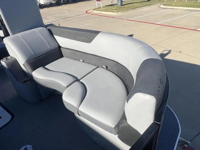 Slide: The Image of 2024 Veranda VR22RC boat seating with gray upholstery in a parking lot. - 9