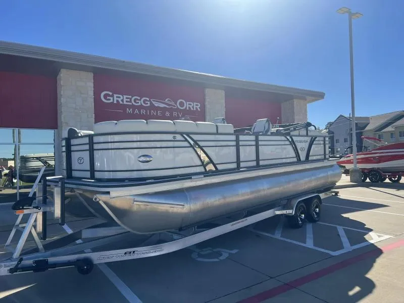 Slide: The Image of 2024 Veranda VP25RC pontoon boat on trailer at Gregg Orr Marine & RV dealership. - 1