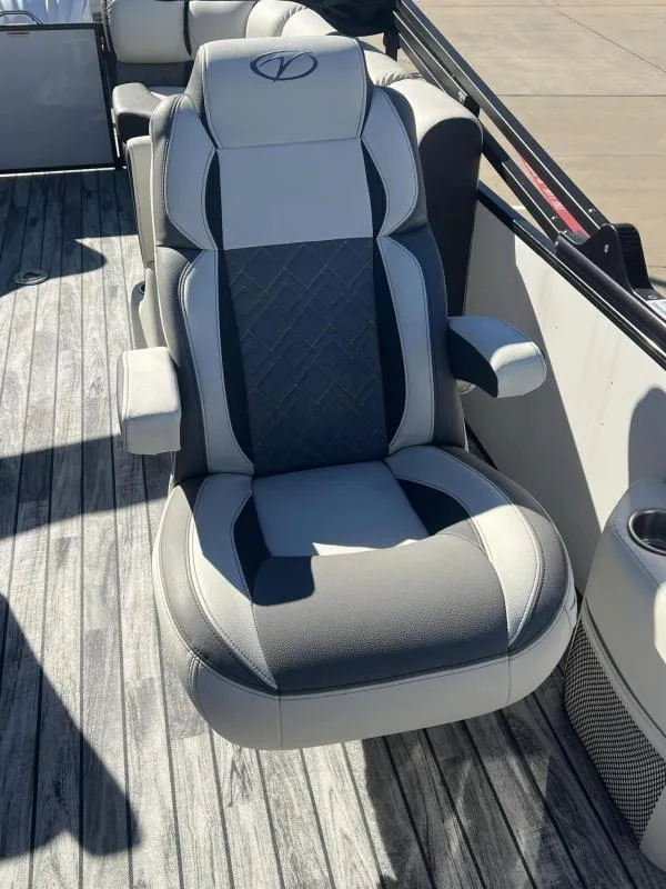 Slide: The Image of 2024 Veranda VP25RC boat seat with gray and black upholstery on deck. - 11