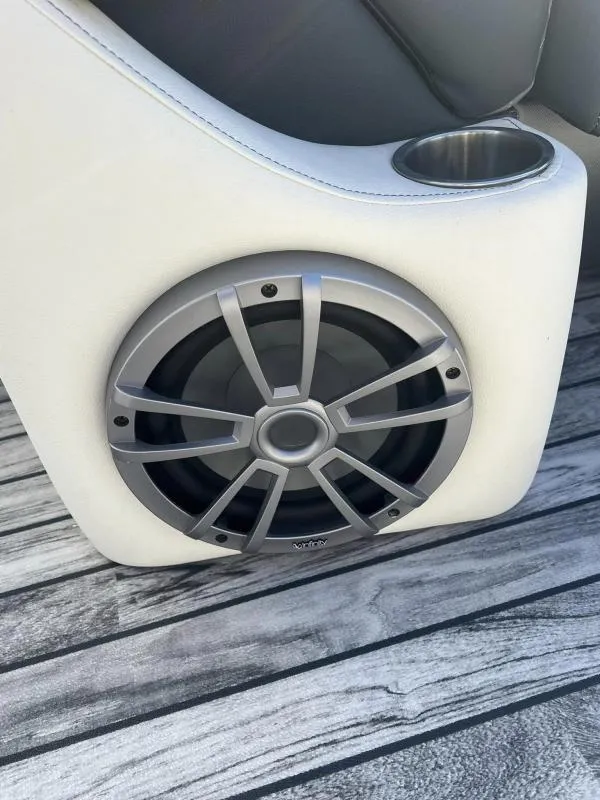 Slide: The Image of 2024 Veranda VP25RC boat speaker and cup holder on wood-textured flooring. - 16