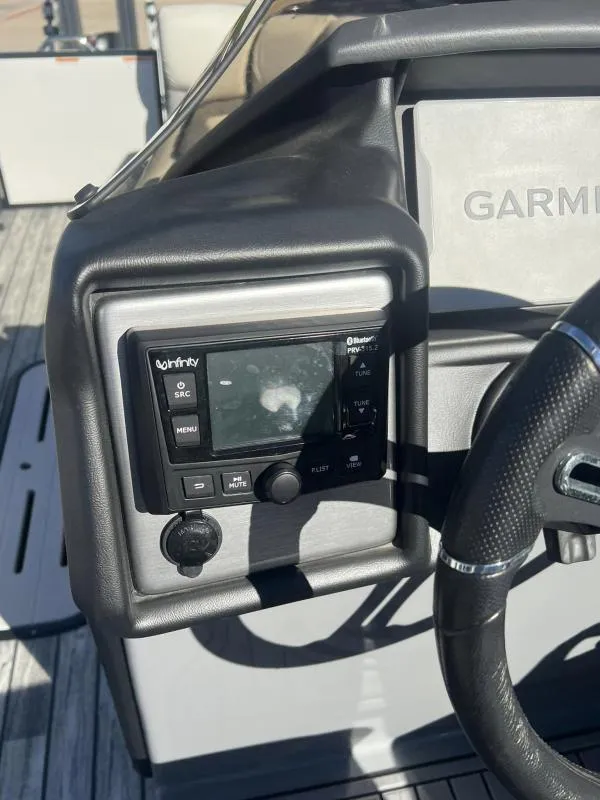 Slide: The Image of 2024 Veranda VP25RC boat dashboard with Garmin and Infinity audio system. - 17