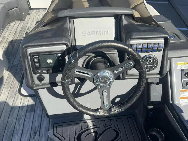 Slide: The Image of 2024 Veranda VP25RC boat dashboard with Garmin navigation and steering wheel. - 18