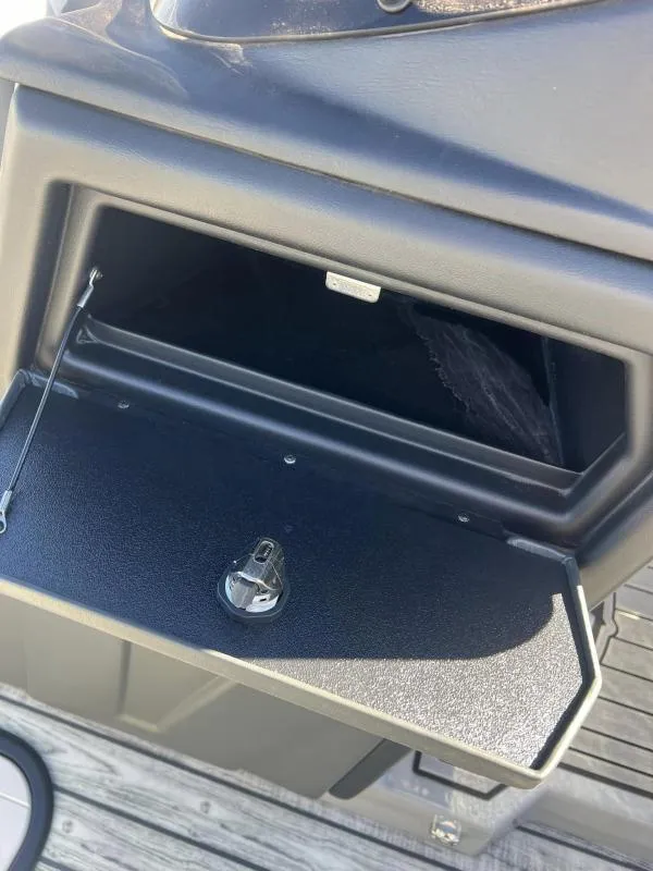Slide: The Image of Open storage compartment on 2024 Veranda VP25RC boat. - 22