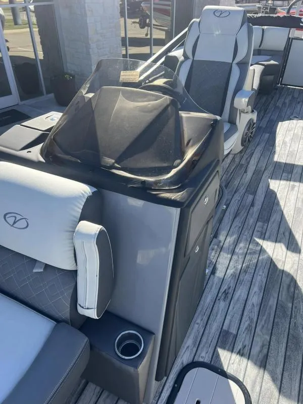 Slide: The Image of 2024 Veranda VP25RC boat interior with modern seating and console design. - 23