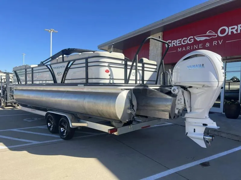 Slide: The Image of 2024 Veranda VP25RC pontoon boat with Yamaha engine at dealership. - 3