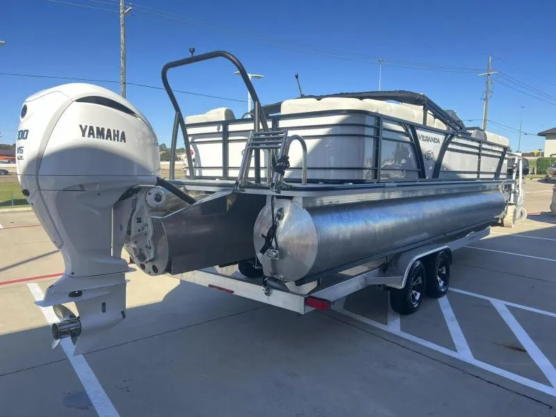 Slide: The Image of 2024 Veranda VP25RC pontoon boat with Yamaha outboard motor in parking lot. - 5