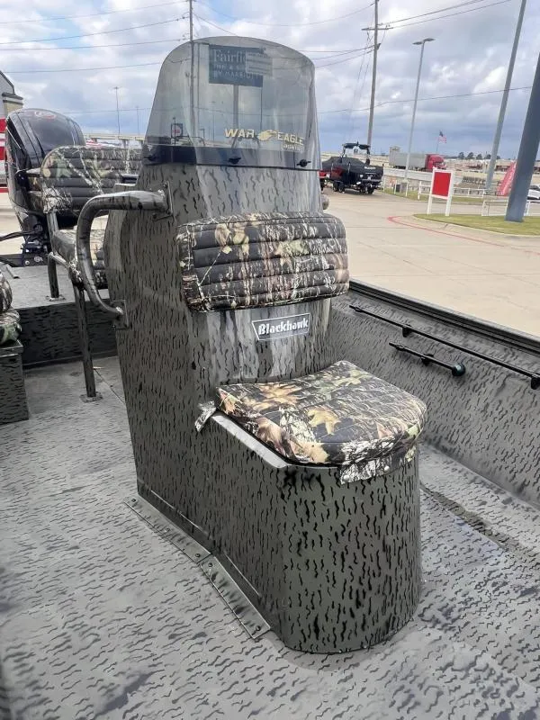 Slide: The Image of 2023 War Eagle 961 Blackhawk boat with camouflage seating and console. - 10