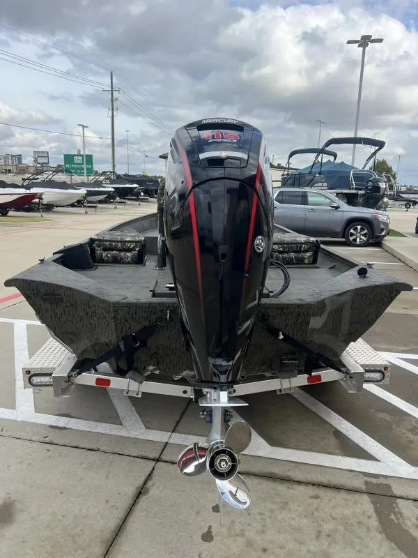 Slide: The Image of 2023 War Eagle 961 Blackhawk boat with Mercury outboard motor on trailer. - 4