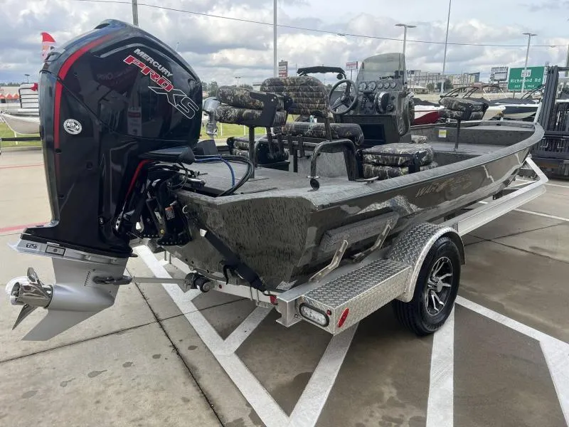 Slide: The Image of 2023 War Eagle 961 Blackhawk boat with Mercury Pro XS engine on trailer. - 5