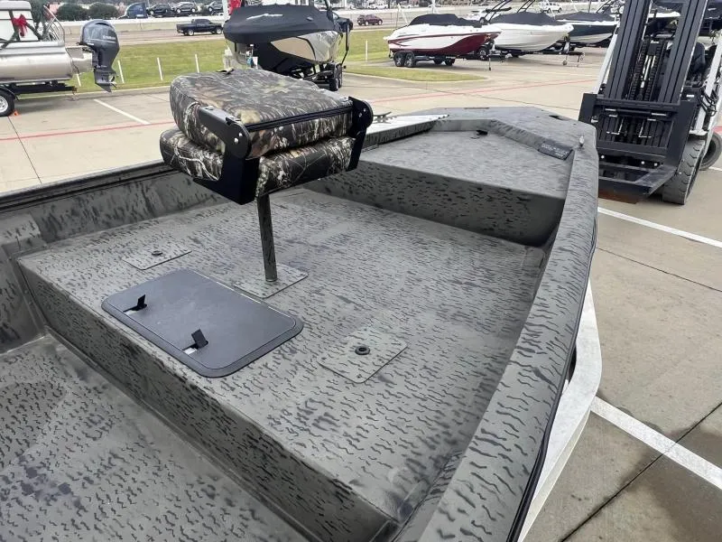 Slide: The Image of 2023 War Eagle 961 Blackhawk boat with camo seat and textured deck. - 9