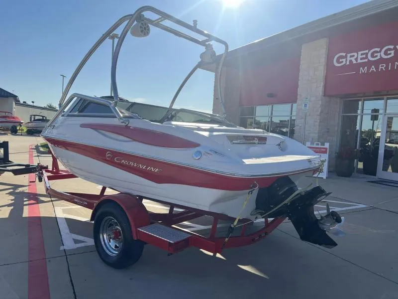 Slide: The Image of 2011 Crownline 185 SS boat on trailer outside Gregg's Marine dealership. - 3