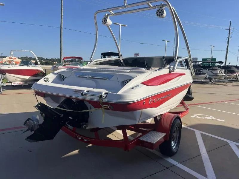 Slide: The Image of 2011 Crownline Boats 185 SS on trailer, red and white design, outdoor display. - 4
