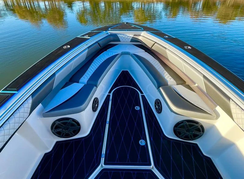 Slide: The Image of Luxurious 2020 Statement 350 Open boat interior with cushioned seating and sleek design on calm water. - 15