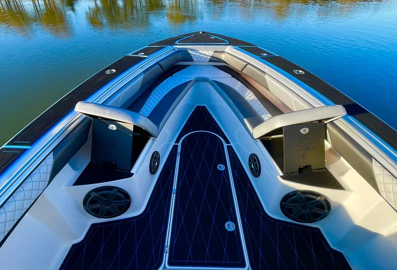 Slide: The Image of 2020 Statement 350 Open boat interior with sleek seating and modern design on calm water. - 16