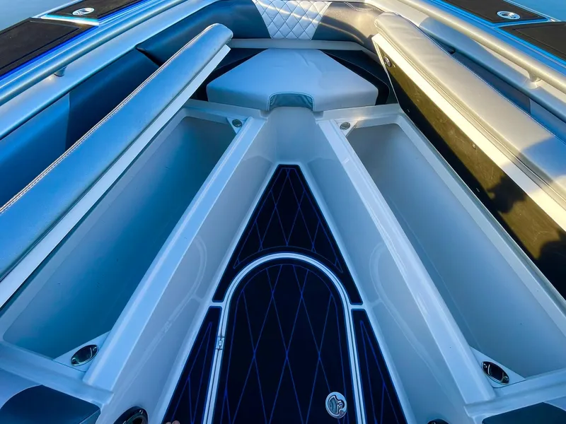 Slide: The Image of Interior view of 2020 Statement 350 Open boat, featuring sleek seating and storage compartments. - 18